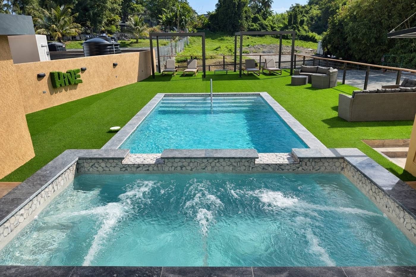 The Hive Scarborough — pool deck and building with the moss Hive sign